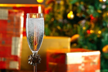  glass with champagne and Christmas ornaments