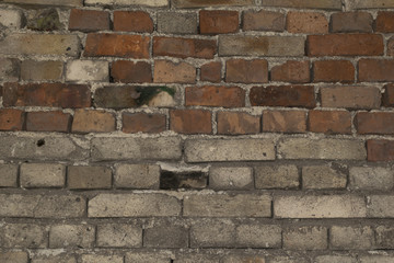 Old broken damaged gray brick wall abstract isolated background texture