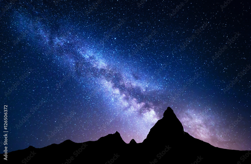 Wall mural night landscape with milky way at mountains. night colorful scenery. sky with stars at summer. beaut