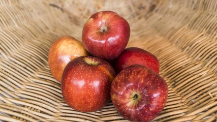 red apples in the basket, selected focus on some apple and the b
