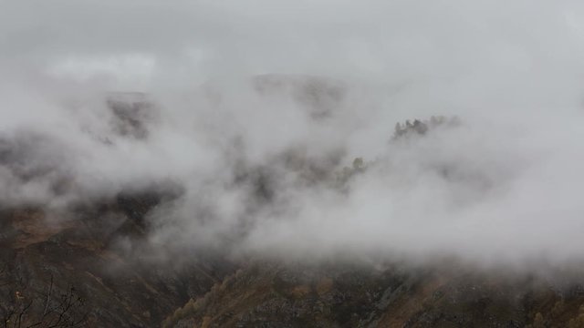Russia, timelapse. The formation and movements of clouds up to the steep slopes of the  mountains of Central Caucasus peaks.