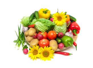 fresh vegetables and blooming sunflowers on a white background