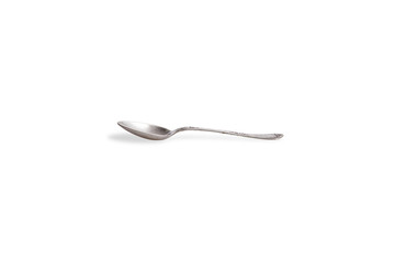 Old silver spoon on white background, low angle view