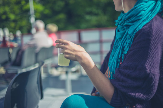 Woman drinking lemonade on a boat