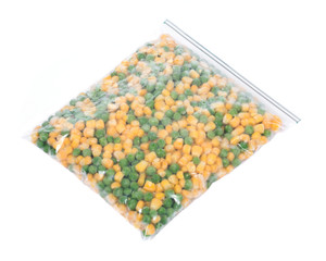 Frozen organic peas and corn in plastic bag isolated on white background