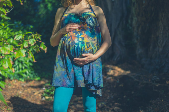 Pregnant woman in forest