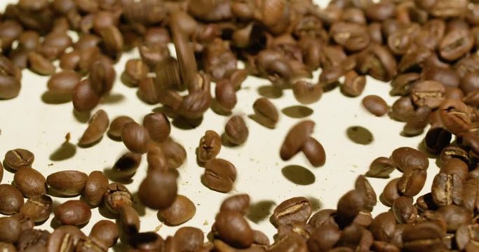 Top view of high quality coffee beans falling
