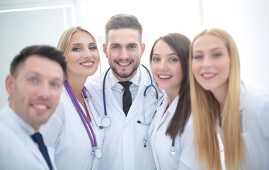 Cheerful team of doctors and interns make selfie