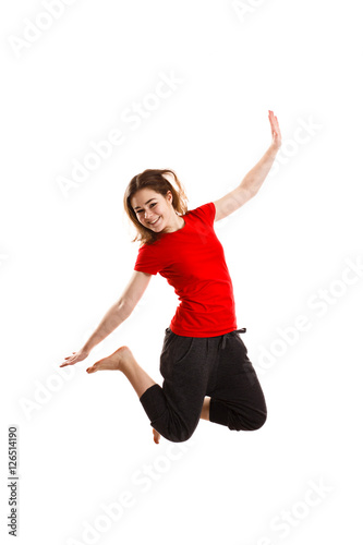 "Young woman jumping on white background " photo libre de droits sur la