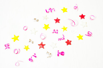 The décor of the stars, confetti on a white background.