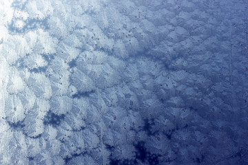 Abstract frost pattern on window as winter background
