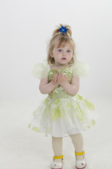 The child, a little girl posing in studio. Carefree childhood. The development and education of preschool children.