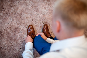 The man wears shoes