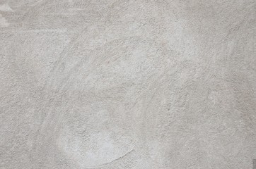 Grau weiss verputzte Wand als Hintergrund
