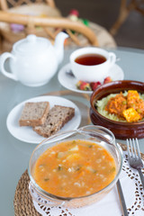 decorated table, a business lunch, hot soup, a cup of tea, Vegetarian