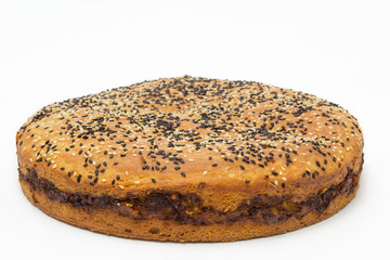 Pie with cabbage and sunflower seeds on a white background, studio photo
