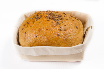 small bread in a basket on a white background, studio photo