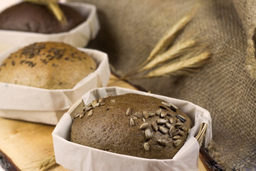 bread in a basket with pigtails in the background, studio photo