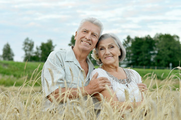 happy senior couple in summer