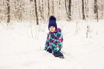 Fototapeta na wymiar Adorable little girl having fun on winter day