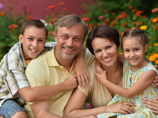 Family resting in  summer park