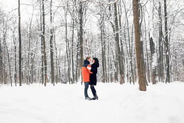Winter in City Park. Couple in winter park.