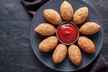 Kibbeh traditional restaurant menu middle eastern beef, lamb, goat or camel meat stuffed bulgur kofta spicy meatball fried croquettes dinner food on dark table background