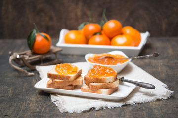 Toasted bread with mandarin jam. Winter mood. Selective focus.
