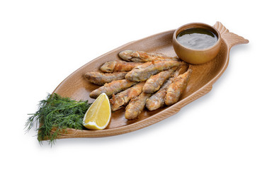 Fried fish goatfish on a plate. Isolated