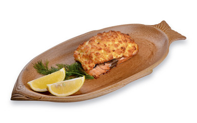 Baked fish in batter with slices of lemon and dill