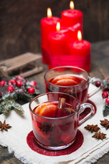 Winter hot drink with fruits and spices. Selective focus.