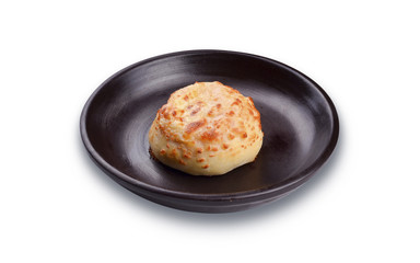Hamburger on a brown plate.