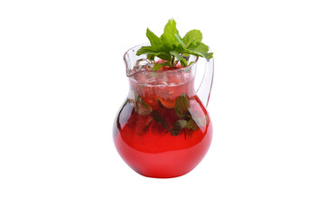 Berry Mojito with strawberries and mint leaves lime with ice in a glass jug