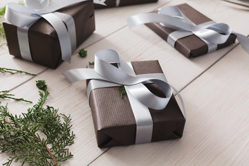 Christmas present boxes on white wood background