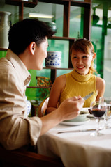 Couple eating in Chinese restaurant