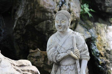 Fototapeta na wymiar Statue Sculpture monk in public garden