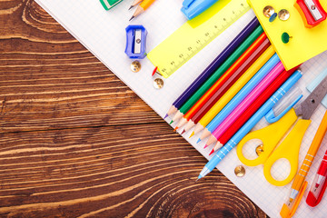 retro wooden table with school supplies