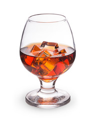 whiskey cognac with ice cubes in a glass