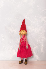 toy red doll girl on the wooden floor