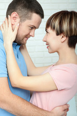 beautiful girl embraces the guy