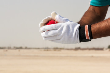 Taking the catch of red ball with hands