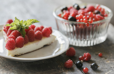 Cake with berries on vintage table