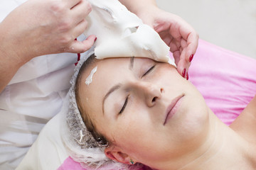 Process of massage and facials in beauty salon