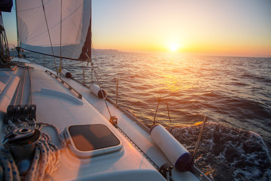 Sailing on the waves during a wonderful sunset. Travel. Luxery yacht.