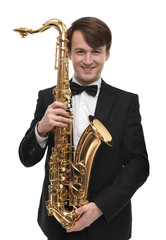 Obraz premium Attractive saxophonist with a saxophone in suit.