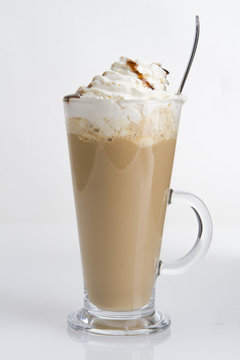 iced coffee latte on white background. delicious milkshake with coffee in a high ball glass