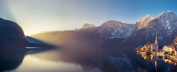 Panoramic View Of Hallstatt at Dawn with sun rays, Austria - in March 2016