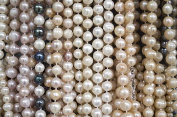Stand with new necklaces of pearls