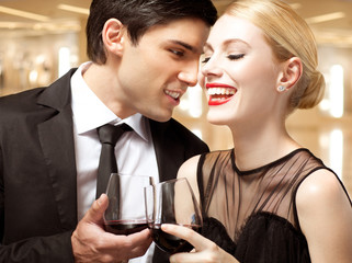 Elegant couple talking at party