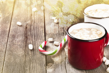 Cup of hot cocoa with marshmallows on a dark background. Toning